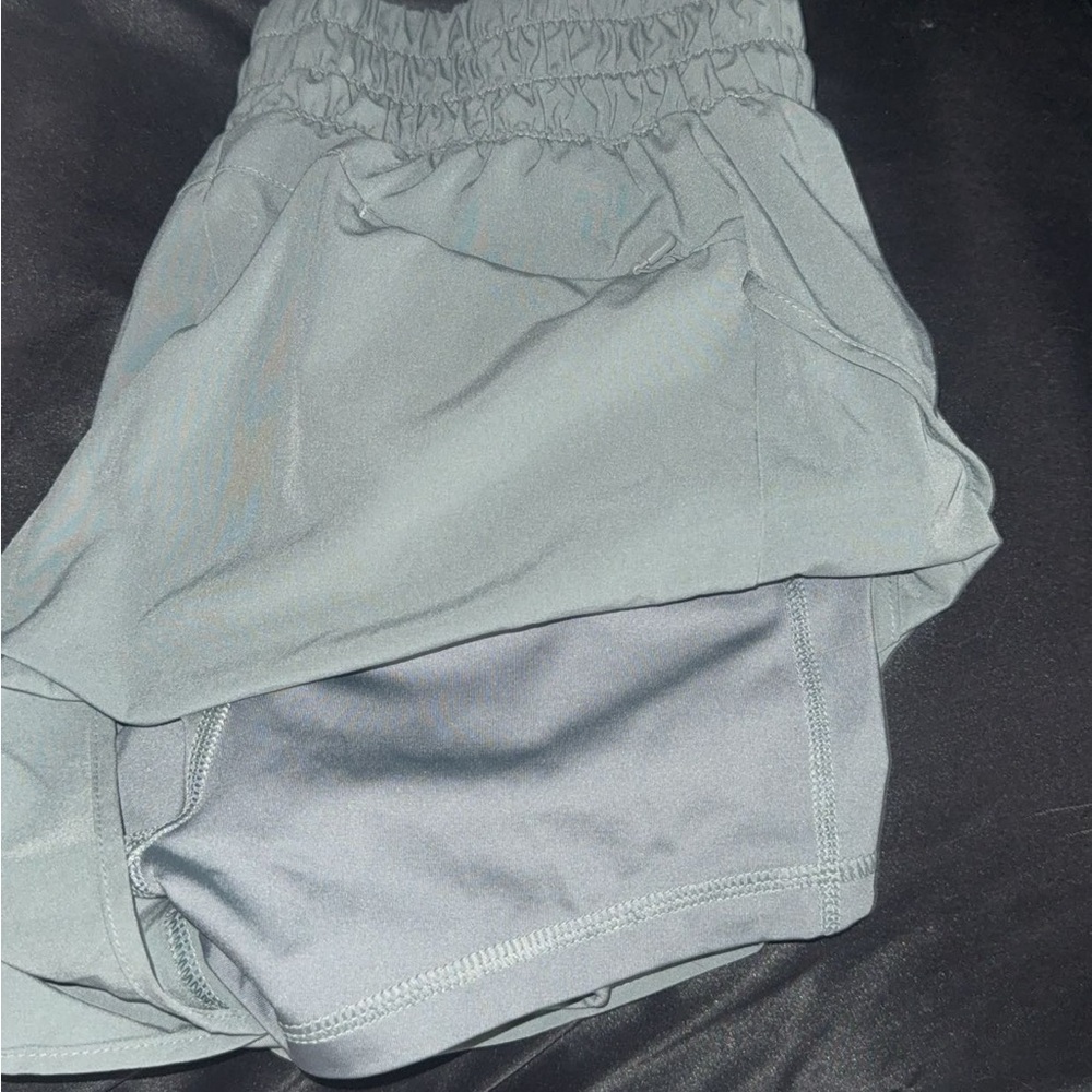 Green athletic shorts